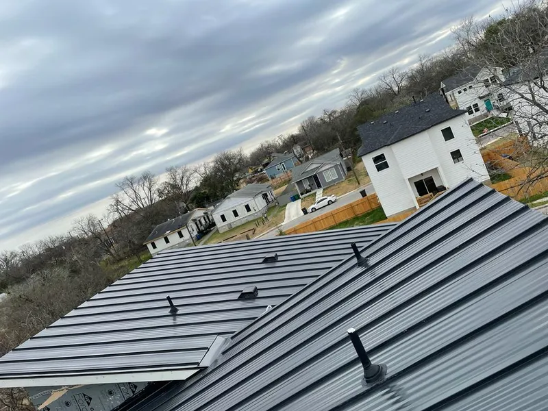 Standing seam metal roof panels with vents for Skylight Repair in Adrian